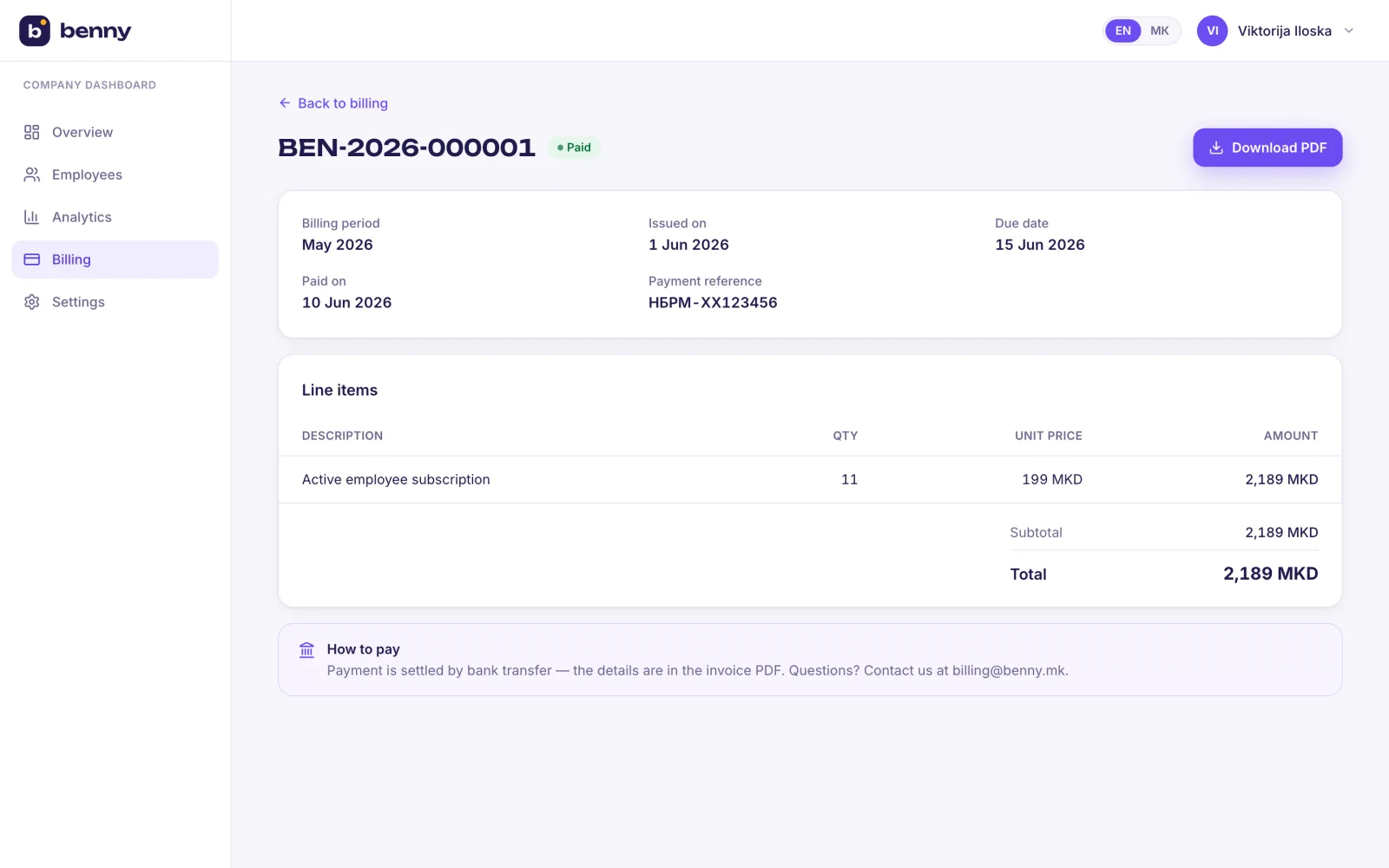A single bilingual invoice with line items and payment status
